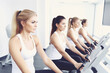 © Mihai Zaharia - A group of beautiful young athletic women working out in a gym. Generative AI