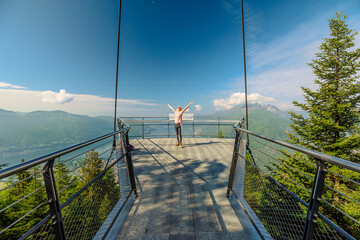 Woman on Aussichtsplattform Cardada platform on top of Cardada-Cimetta mount in Switzerland. Skyline from Swiss chairlift of Locarno on Cardada mount. Lake Maggiore cityscape in Ticino.