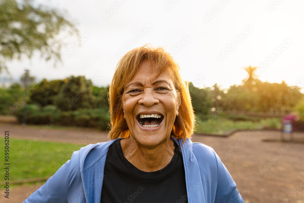 Happy senior Latin woman having fun smiling on camera after training ...