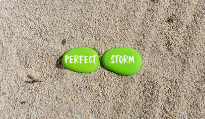Perfect storm symbol. Concept words Perfect storm on beautiful green stone. Beautiful sand sea beach background. Business and Perfect storm concept. Copy space.