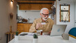 © Miljan Živković - One man senior caucasian male hold medicine drugs tablet read label