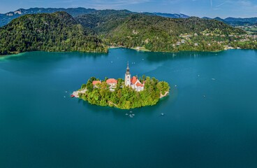 Beautiful idyllic aerial view on island, castle, catholic Maria church in lake Bled.  Slovenia