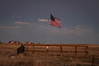A flag at a rural ranchland homestead