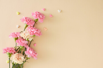 mother's day floral gift concept. top view photo of bunch of pretty carnation flowers and small hear