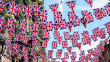 Fototapeta Londyn - Union Jack flags hanging at the street ready to national holiday celebration
