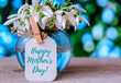 Happy Mothers Day lettering greeting card. Spring flowers snowdrop. Best mom ever. Holiday concept.