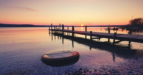 Wall Mural - Sea lake sunset over old wooden jetty pier on the shore, relaxing nature landscape, 4k video
