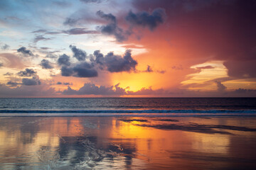 Wall Mural - USA, Georgia, Tybee Island. Sunrise with reflections and clouds.