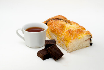 Wall Mural - Bread with Chocolate  and cup of tea on a white background.