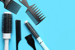 © Pixel-Shot - Hairdresser's brushes on blue background