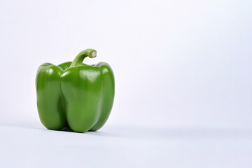 Wall Mural - green bell pepper isolated on white background with copy space. Created with Generative AI Technology