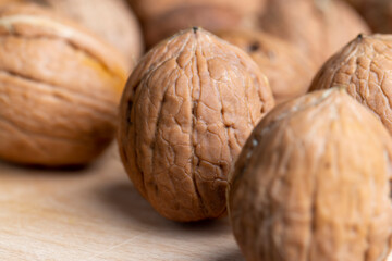 Unpeeled walnut harvest on the table