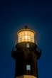 Close up of the Tybee Island Light Station at night with stars in the background.  Image taken at blue hour.