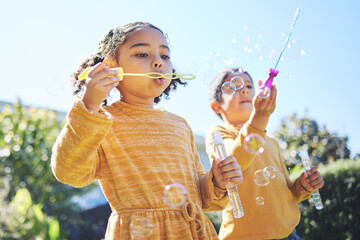 Poster - Playing, garden and children blowing bubbles for bonding, weekend activity and fun together. Recreation, outdoors and siblings with a bubble toy for leisure, childhood and enjoyment in summer