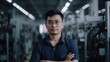 © Summit Art Creations - A smiling Chinese male electronic factory worker standing in factory. Generative AI AIG19.