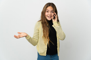 Wall Mural - Little girl over isolated white background keeping a conversation with the mobile phone with someone