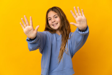 Canvas Print - Child over isolated yellow background counting ten with fingers