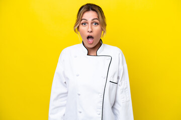 Sticker - Uruguayan chef woman isolated on yellow background with surprise facial expression