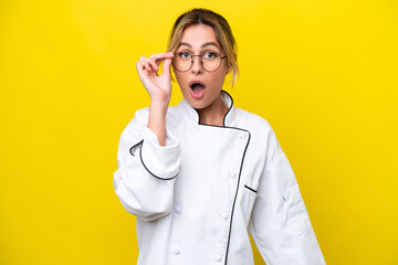 Sticker - Uruguayan chef woman isolated on yellow background with glasses and surprised