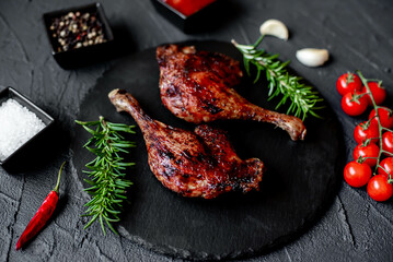 Wall Mural - grilled duck legs on a stone background