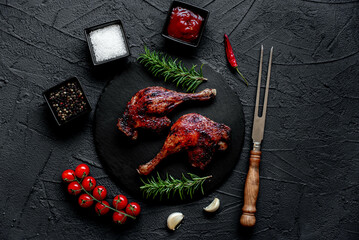 Wall Mural - grilled duck legs on a stone background