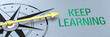 © Zerbor - Compass needle pointing to the words Keep learning - 3d rendering