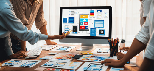 Poster - Panorama shot of front-end developer team brainstorming UI and UX designs for mobile app on laptop computer screen. User interface development team planning for user-friendly UI design. Scrutinize