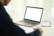 © Prathankarnpap - Cropped shot of male entrepreneur using laptop with blank empty mockup screen, watching webinars, working remotely