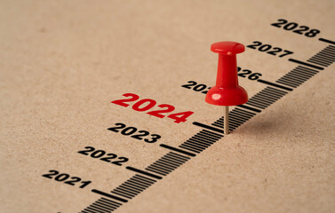 Wall Mural - red pin on paper with 2024 year for preparation merry christmas and happy new year concept.