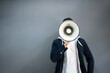 © Andrey Popov - Man Hand Holding Megaphone