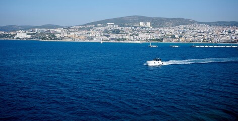 Poster - Aerial view of a sailboat drifting peacefully on a tranquil body of water in Kusadasi, Turkey