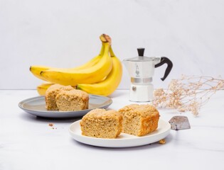 Sticker - Moka pot and pieces of freshly baked banana cake on a marble table