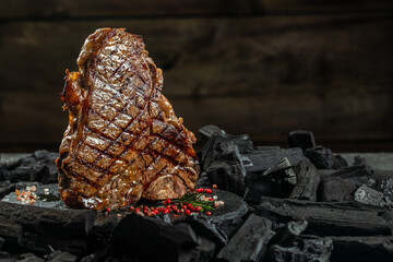 Wall Mural - Beef T-bone steaks on BBQ grill coal. porterhouse steak or T Bone Steak. Restaurant menu, cookbook recipe. place for text, top view