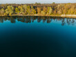 Bird's eye view of the lake and forest. Spring nature. View from a drone