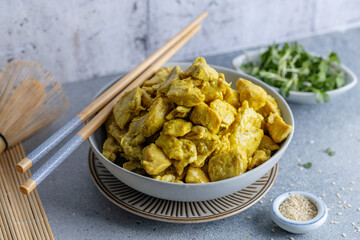 Wall Mural - Chicken in curry sauce served in bowl