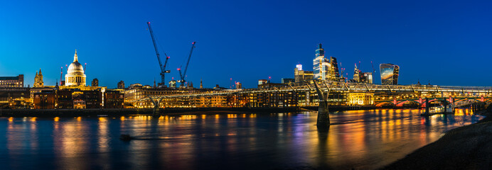 View of Millennium Bridge and St. Pauls Cathedral, River Thames, London, England