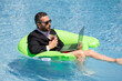 © Volodymyr - Summer business dreams. Business man in suit floating with cocktail and laptop in swimming pool. Summer business vacation. Funny crazy businessman rest in formal wear in pool. Hot summer business.