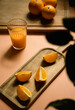 Oranges and orange juice over a table with background