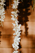 Elegant wedding florals hanging in the sun