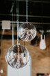 Hanging Disco Balls in a Wedding Venue with string lights