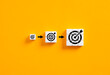 © Cagkan - Setting business goals. Developing goals and objectives. Growing target symbols on white cubes on yellow background.