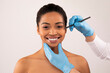 © Prostock-studio - Happy attractive young black woman attending aesthetic clinic