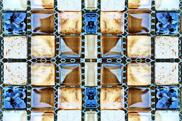 Wall Mural - A close-up view of ceramic tile and small brick used for facing wall and houses. Abstract background with squares and rectangles in a mosaic style.