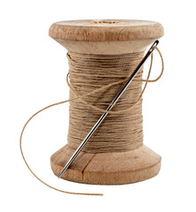 Wall Mural - Old wooden spool of thread and needle on a white background. Sewing accessories