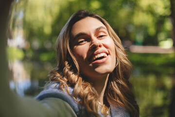 Sticker - Photo of nice pretty happy charming blonde curly woman summer enjoy good mood make selfie camera outdoors outside park.