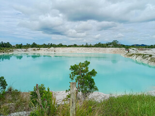 Wall Mural - Kaolin Lake or Danau Biru. Kaolin quarry, blue lake of kaolin quarry. Beautiful kaolin lake in Belitung. 