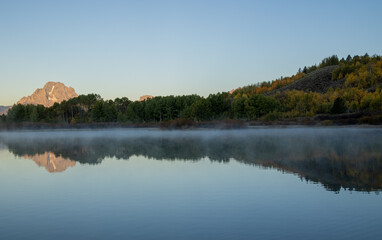 Wall Mural - Beautiful Sunrise Landscape Reflection in the Tetons in Autumn