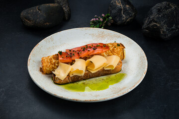 Wall Mural - Breakfast omelette with tomatoes, cheese and bread in plate.