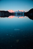 Fototapeta Morze - Mountain reflection in a lake at sunset. Beautiful winter landscape.