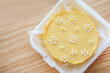 Beautiful cake with daisies made of cream and mastic, yellow summer cake